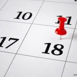 un calendrier avec une épingle sur le 18